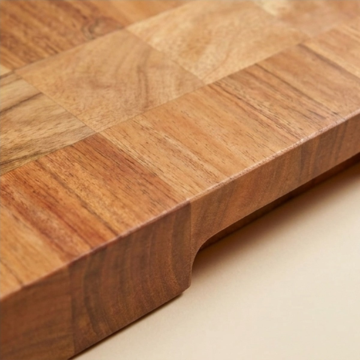 Close-up of the natural wood grain on a solid acacia chopping board