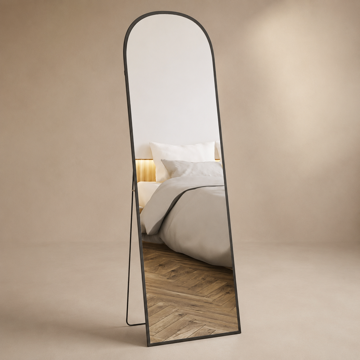 Arched black full-length mirror with slim freestanding support