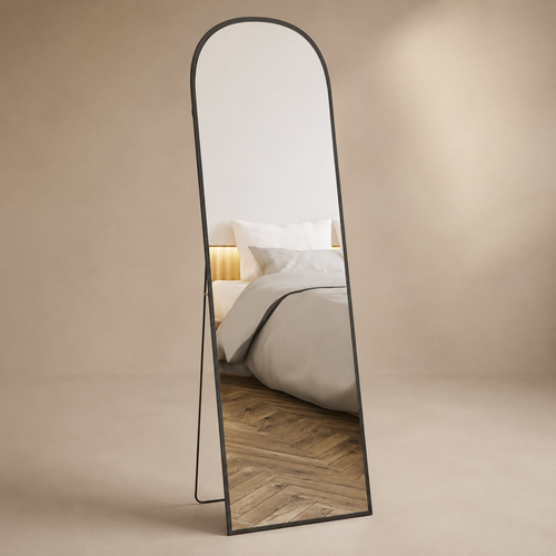 Arched black full-length mirror with slim freestanding support