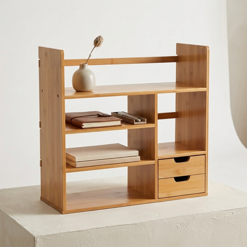 Bamboo desktop organiser with shelf and drawers on a white background