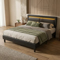 Black upholstered king size LED bed with charging headboard premium product hero view in a bedroom