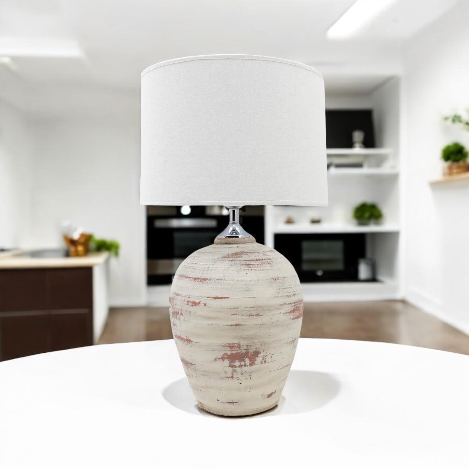 Cream ceramic table lamp on a table in a kitchen dining space
