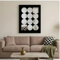 Decorative acrylic mirror wall art with black frame from a customer-friendly angle in a living room