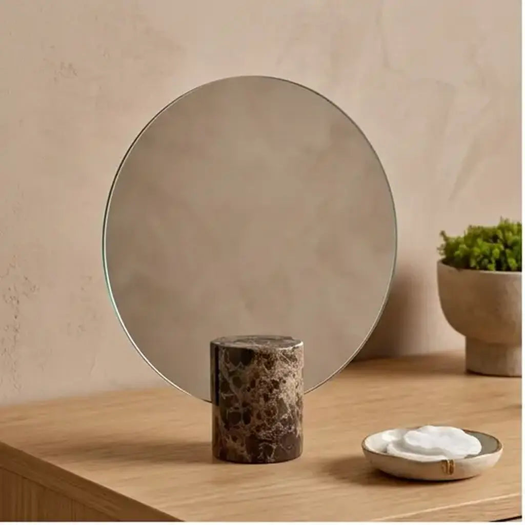 Freestanding vanity mirror with marble-effect base in a contemporary bedroom