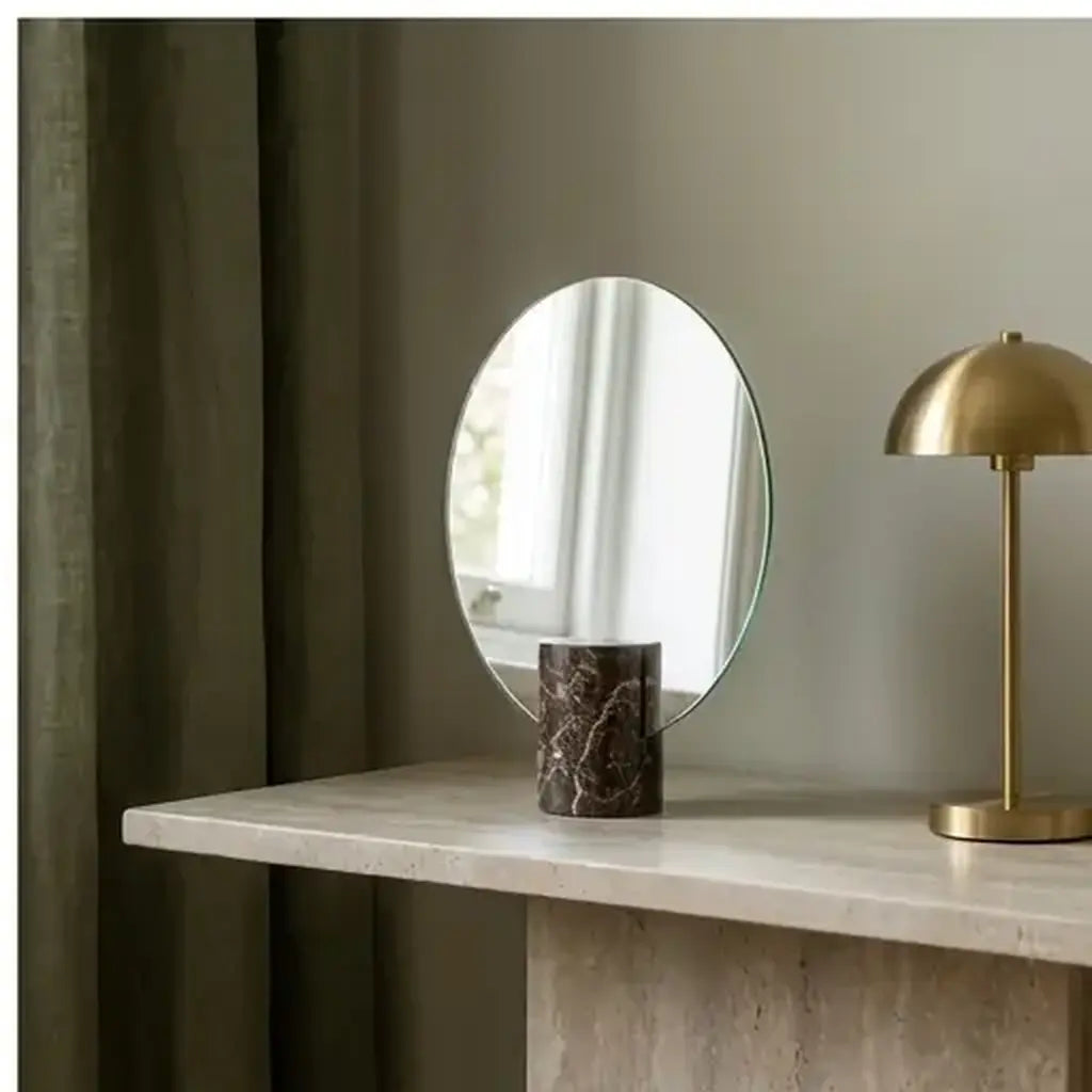 Freestanding vanity mirror with marble-effect base premium product hero view in a bedroom