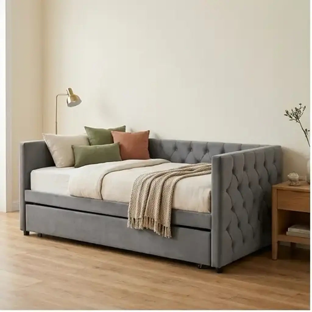 Grey velvet daybed with trundle and charging point in a contemporary guest room