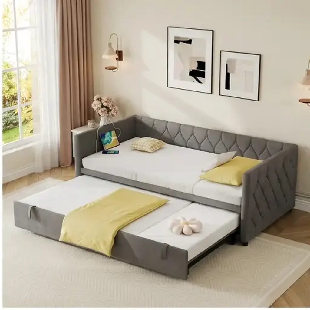 Grey velvet daybed with trundle and charging point shown at room scale in a guest room