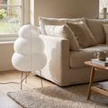 Rice paper floor lamp beside a linen sofa in a calm living room
