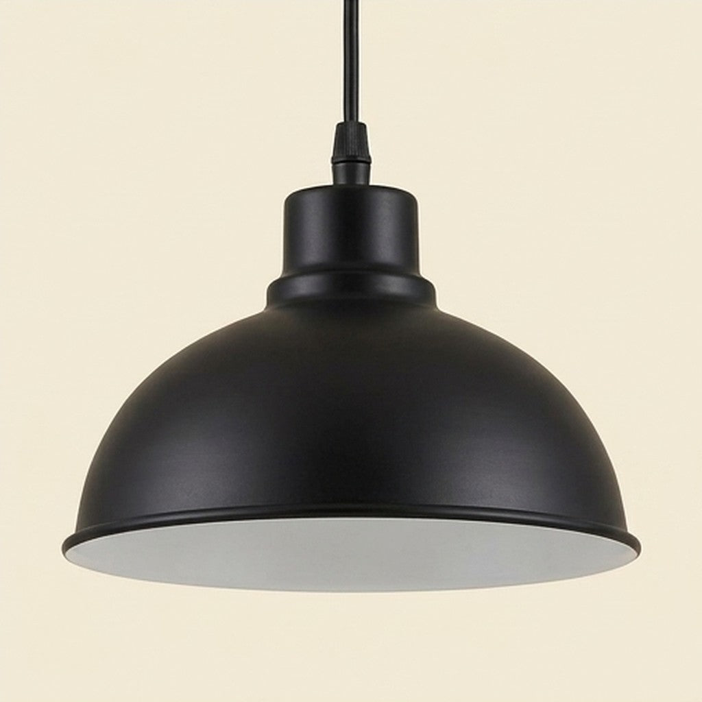 Close-up of a black dome pendant shade with white inner finish