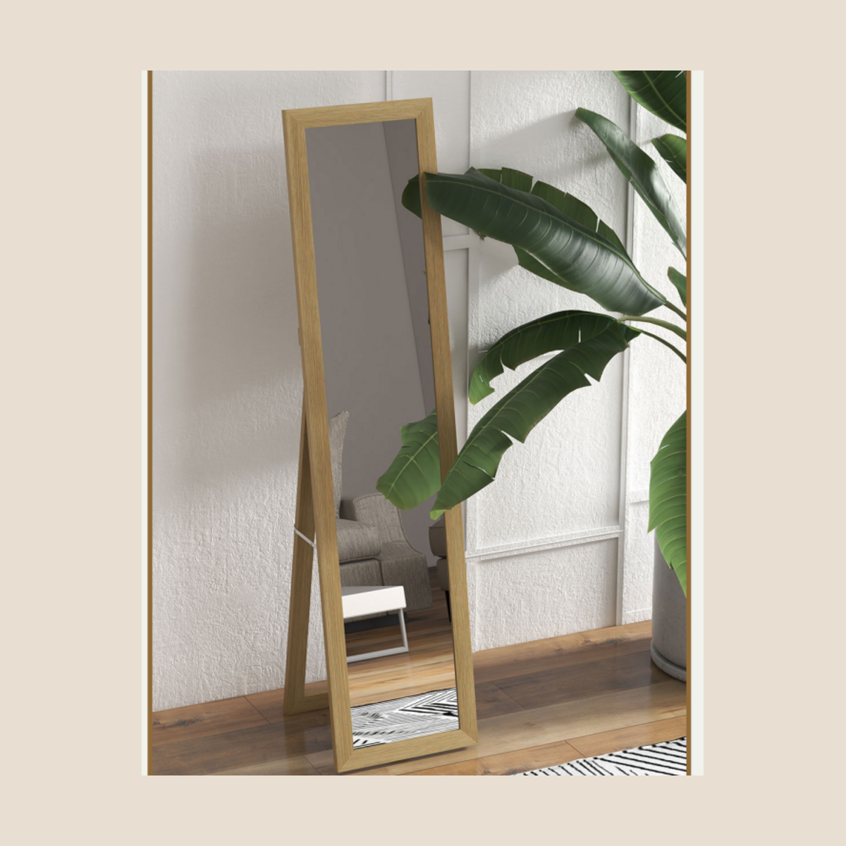 Natural wood full-length mirror shown in floor-standing position