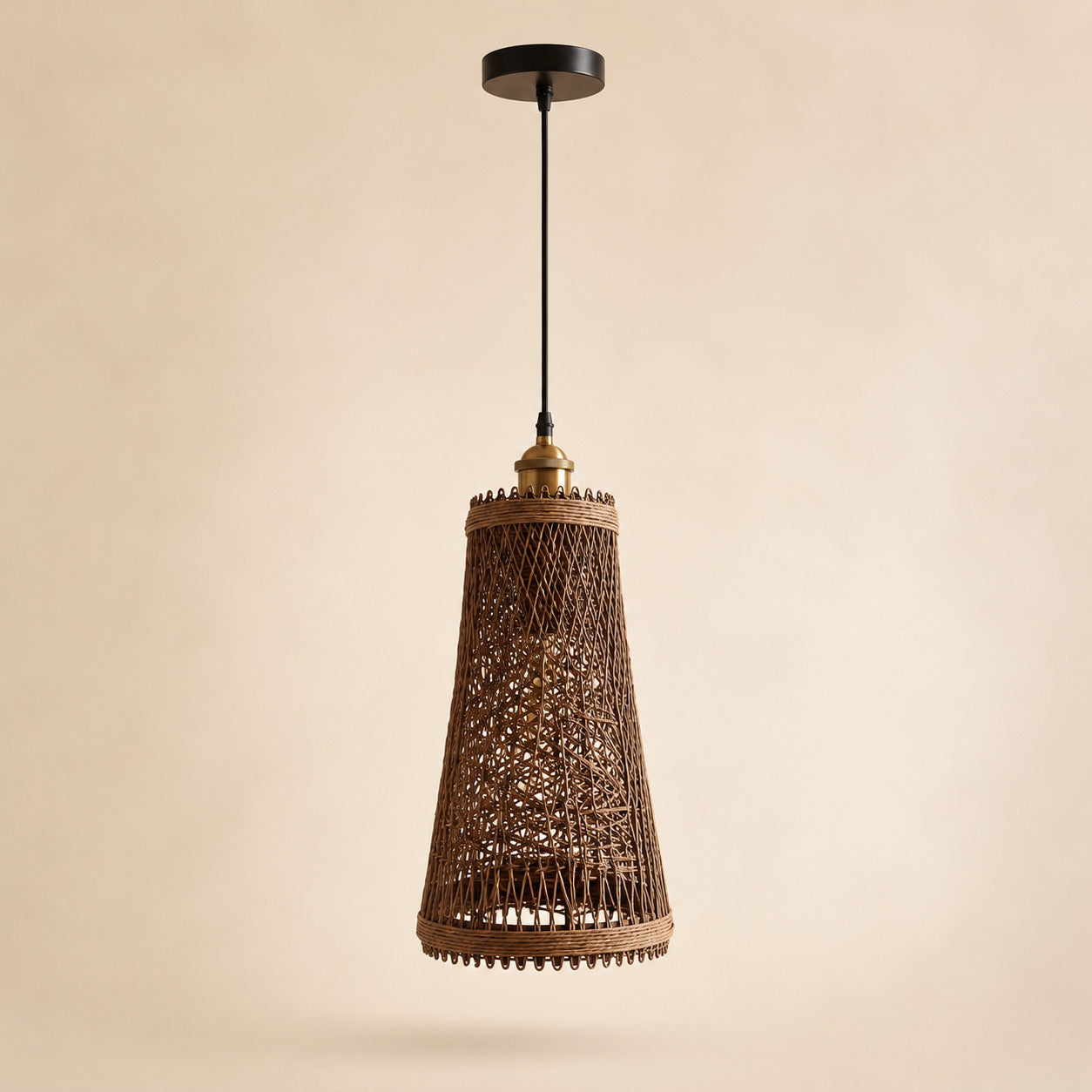 Rattan ceiling light with large natural woven shade on a warm cream Nestria background