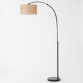 Rattan arc floor lamp with hemp rope shade on a white background