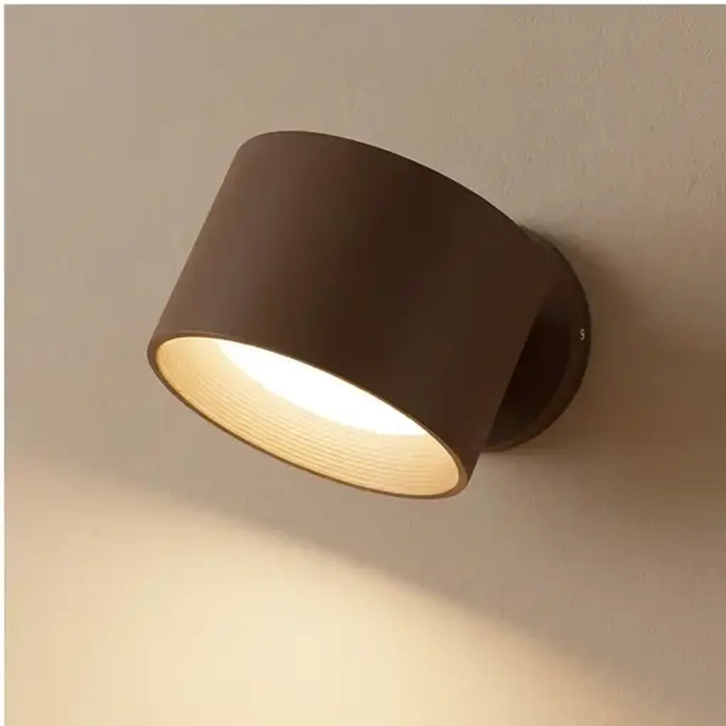 Rechargeable wall light with warm white LED shown at room scale in a bedroom