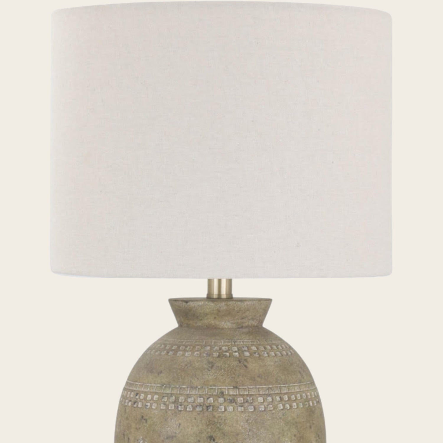 Cream linen-look shade on the rustic ceramic table lamp