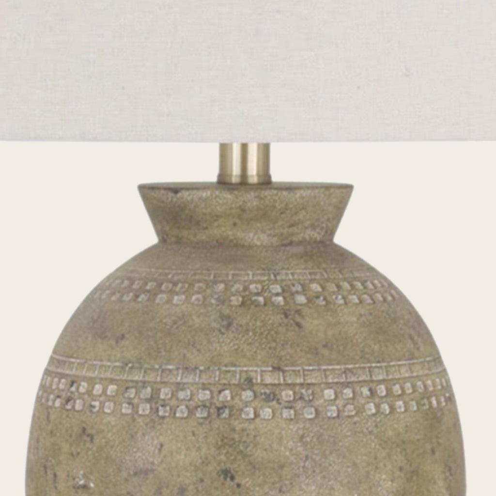 Detail of the lamp neck and cream shade