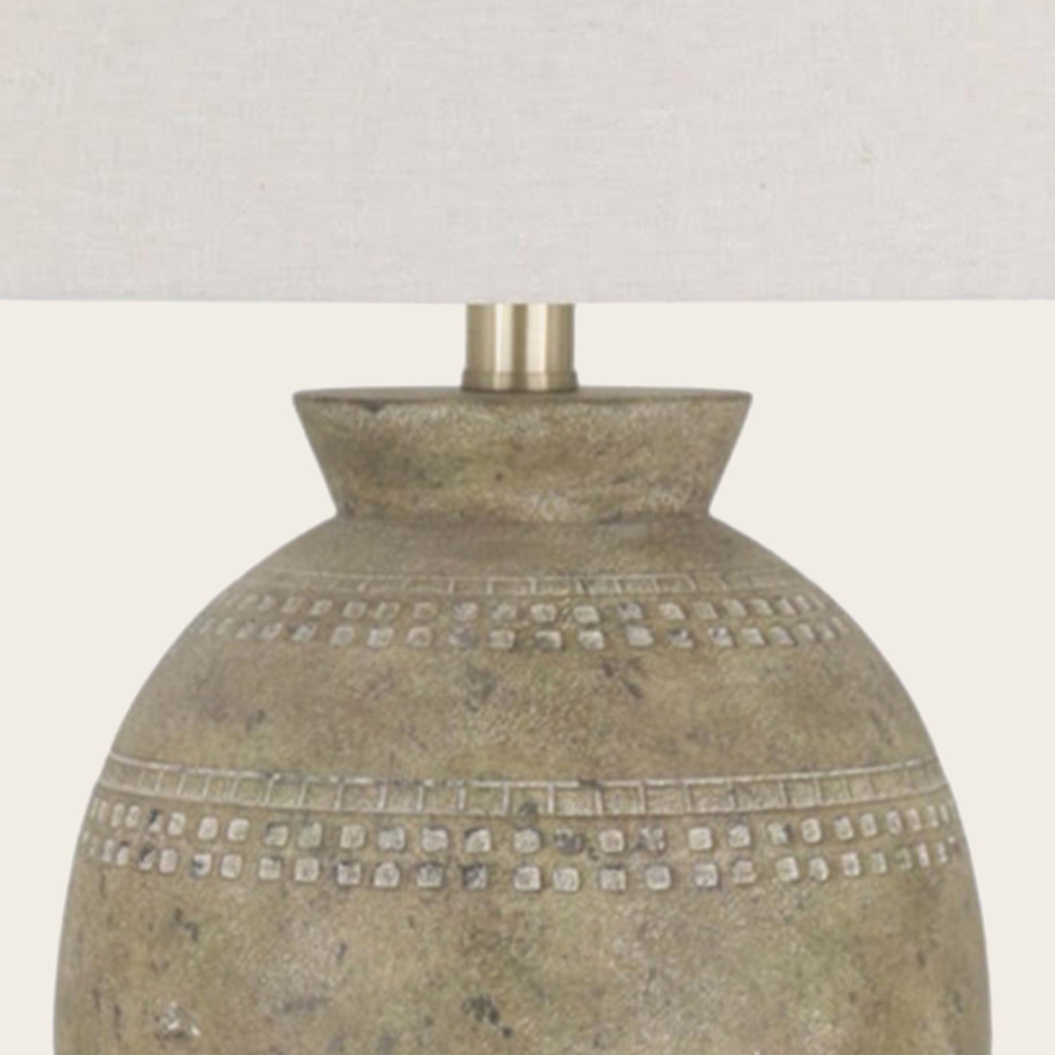 Detail of the lamp neck and cream shade