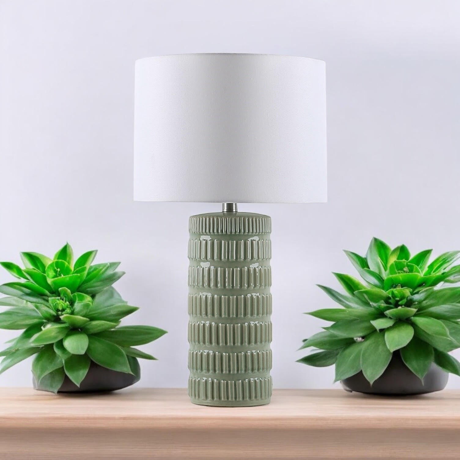 Sage green floral ceramic table lamp with cream drum shade
