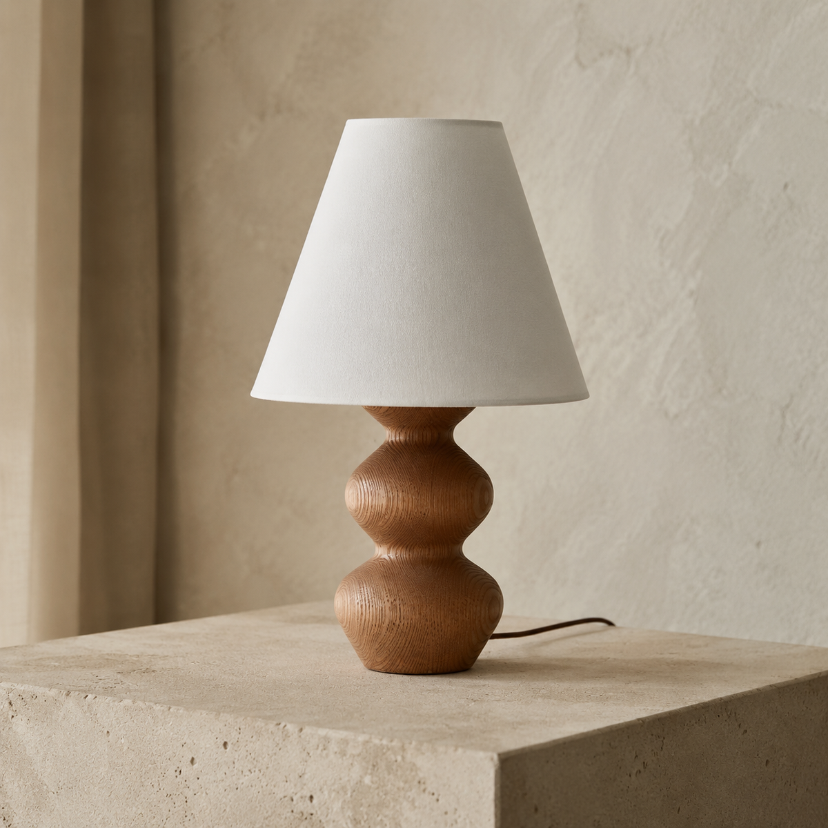 Three-quarter view of Silvan sculptural walnut wood table lamp