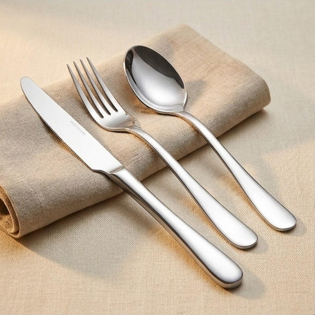 Stainless steel knife fork and spoon displayed on a linen napkin