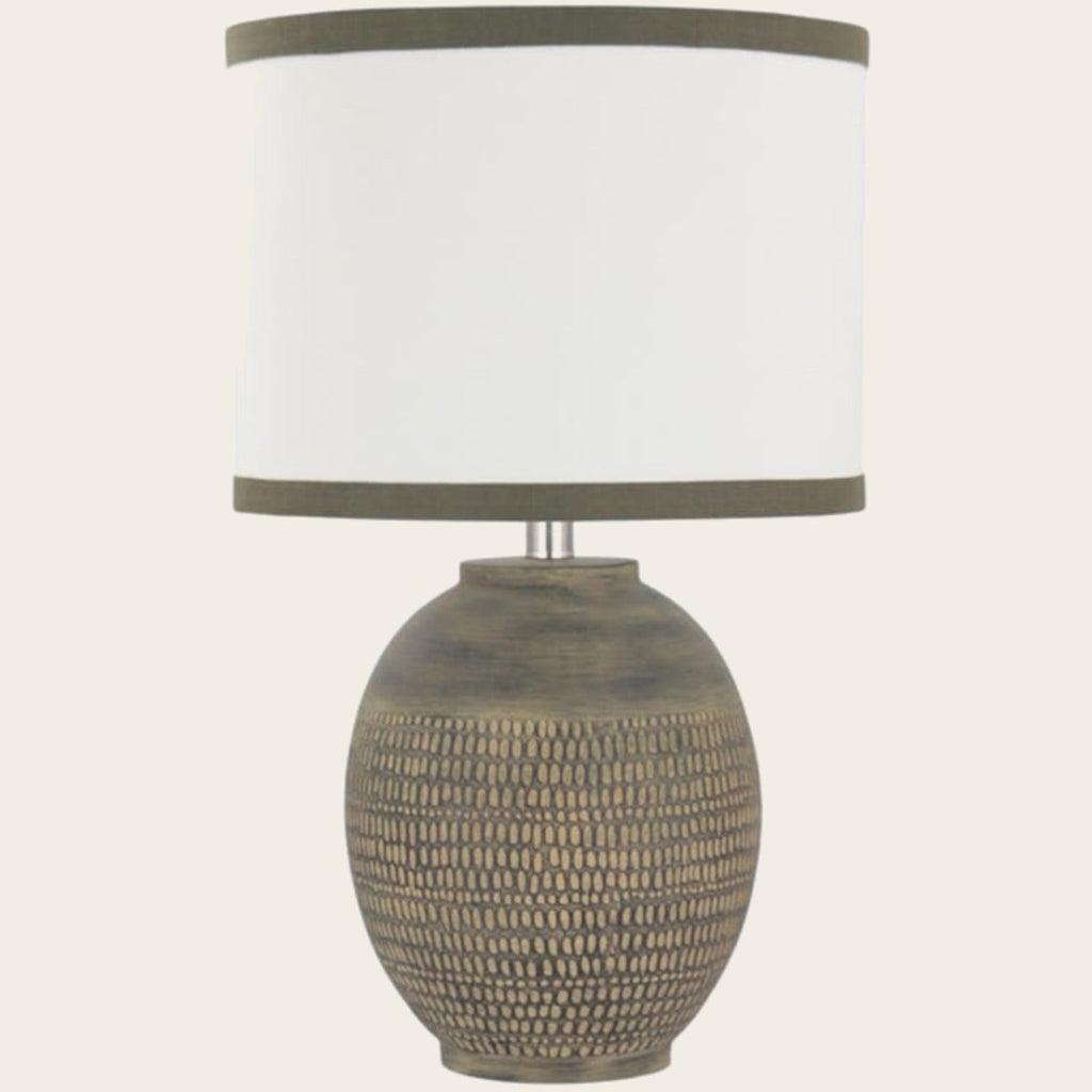 Textured beige ceramic table lamp with bordered cream shade