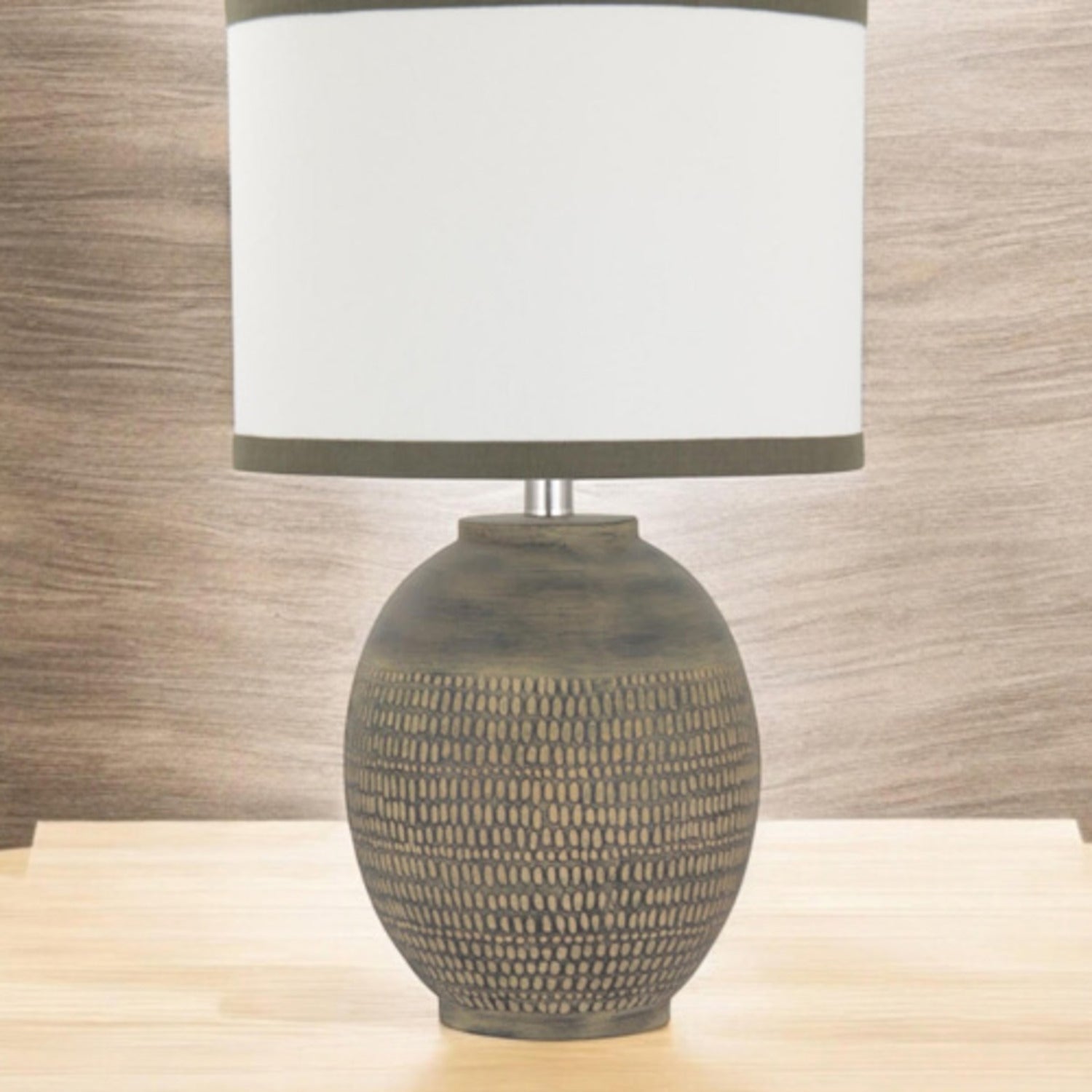 Closer view of the textured beige ceramic table lamp