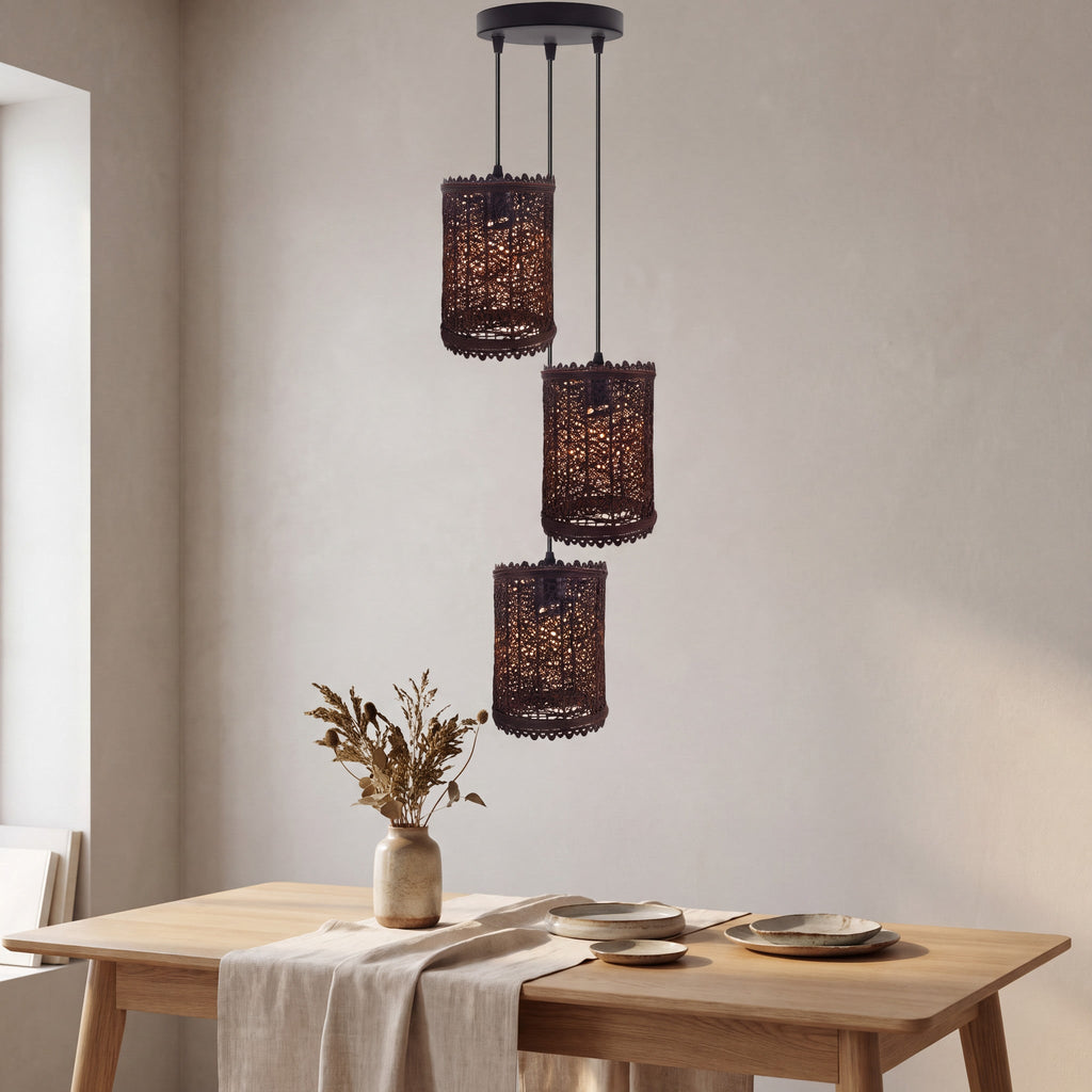 Three-light rattan pendant with woven shades styled in a calm neutral room
