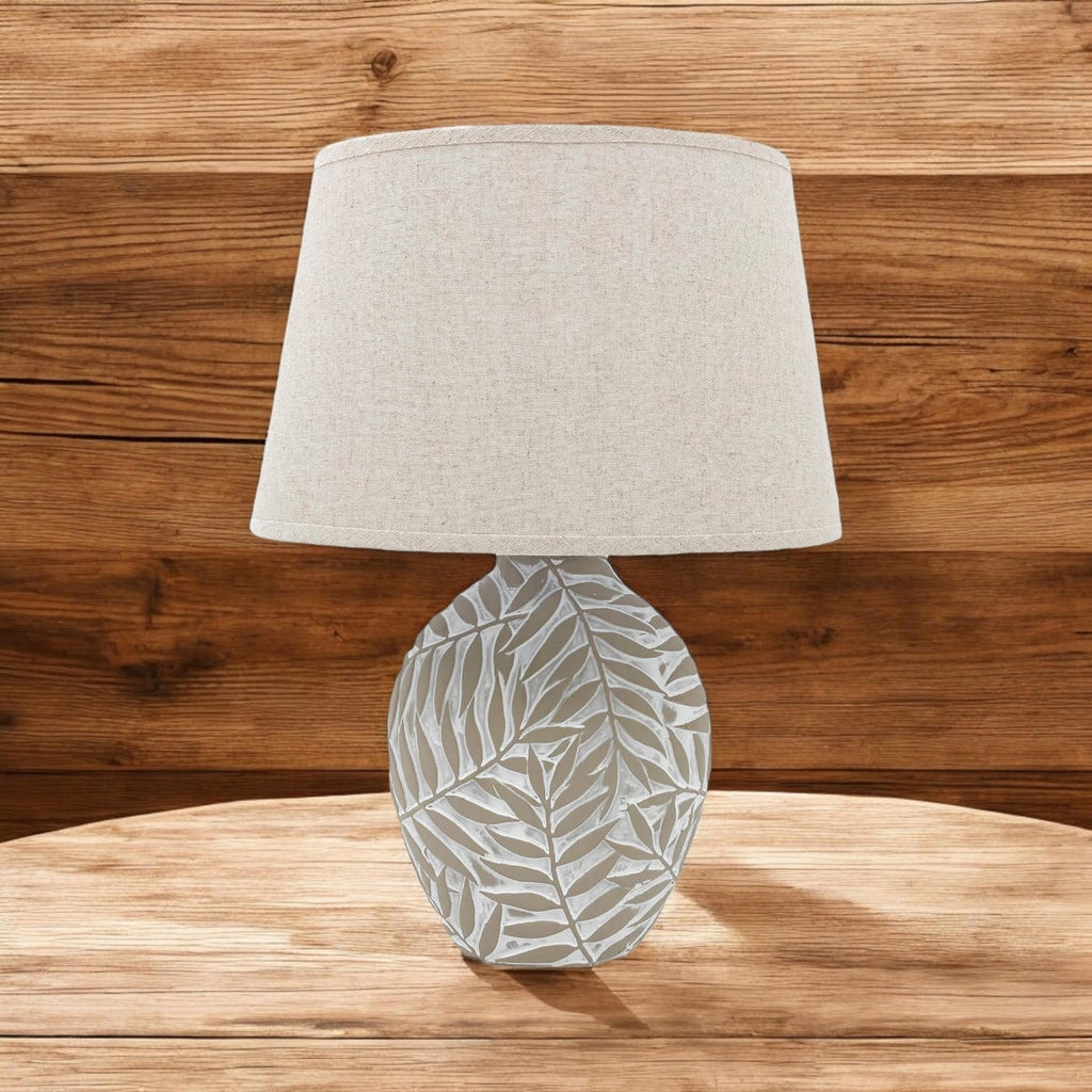 Warm white ceramic table lamp in a neutral hallway