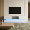 White high-gloss 160cm LED TV unit with storage from a customer-friendly angle in a living room